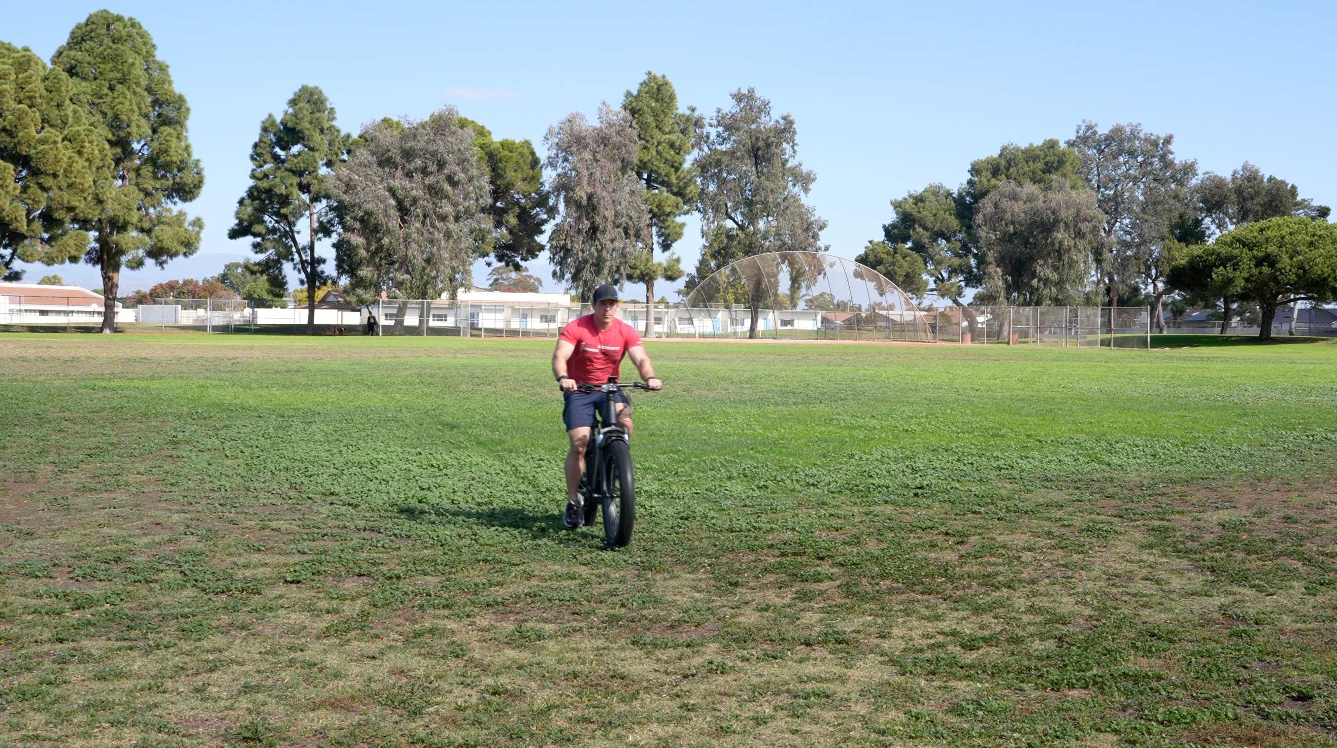 a person riding a motorcycle in a field