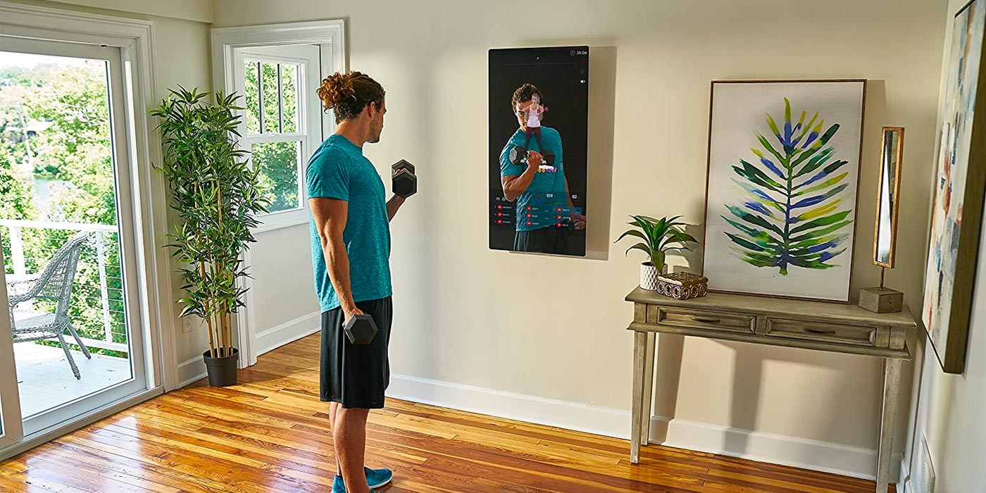 a person standing in front of a television