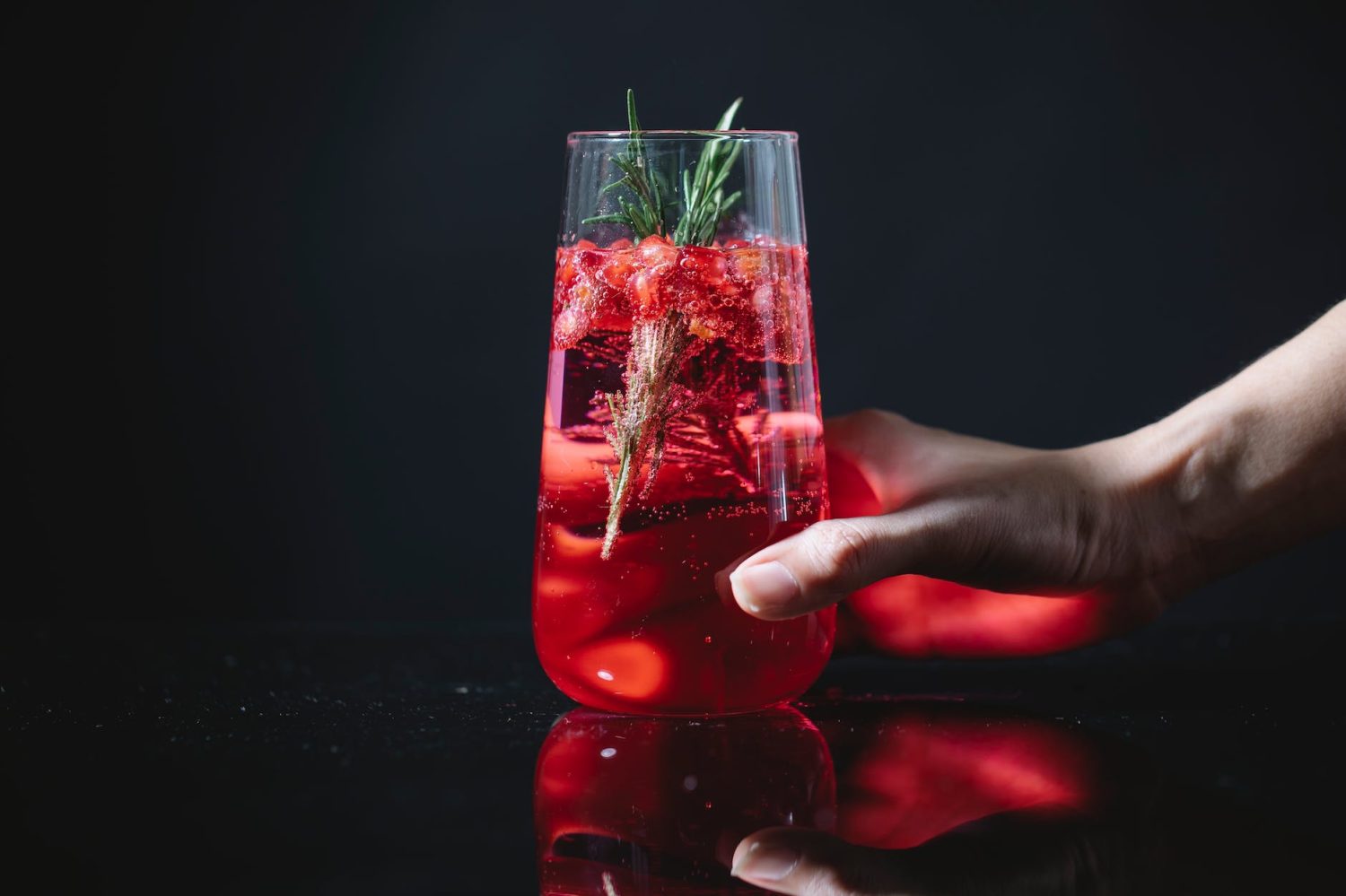 crop woman with glass of red cocktail