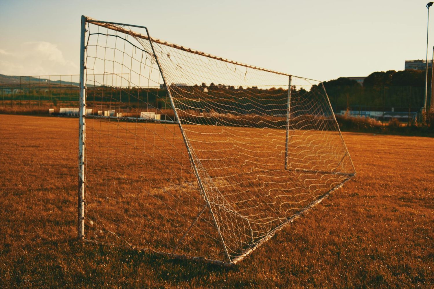 photography of white soccer goal post