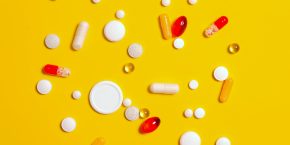 medication pills on yellow surface