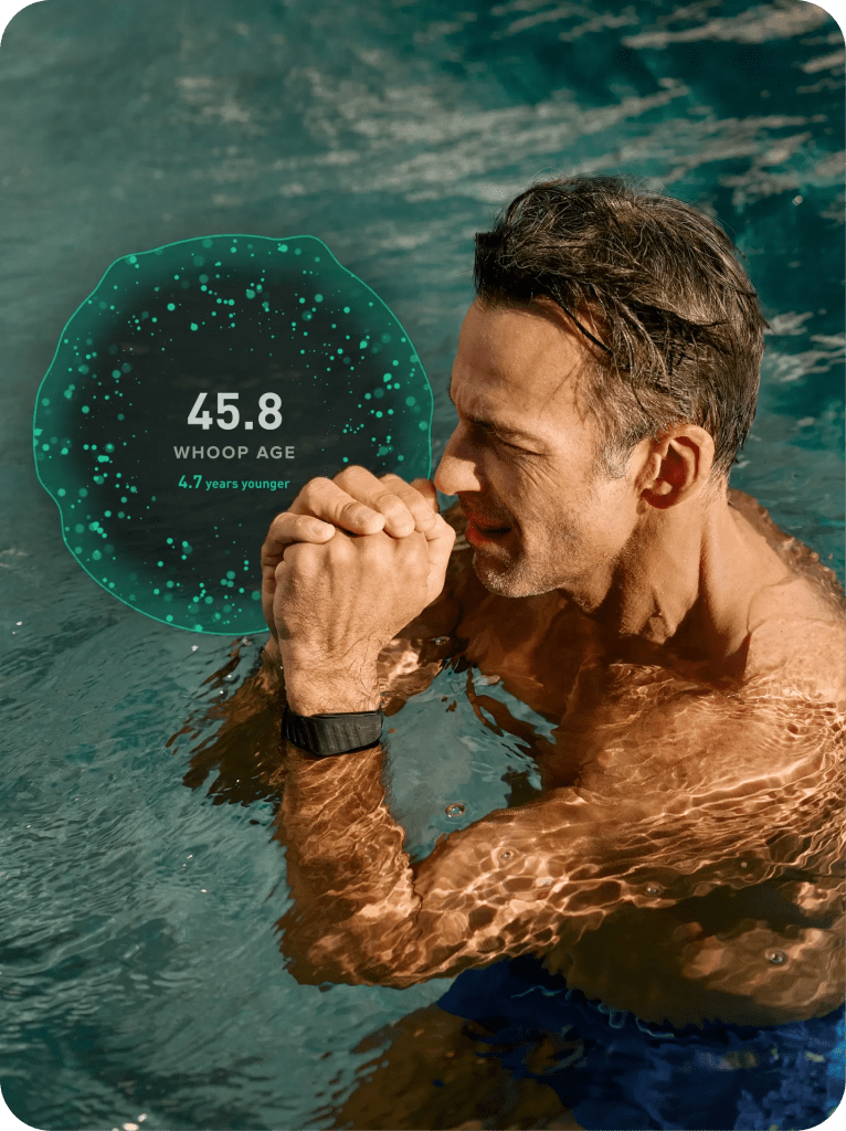 A man in water with his hands clasped