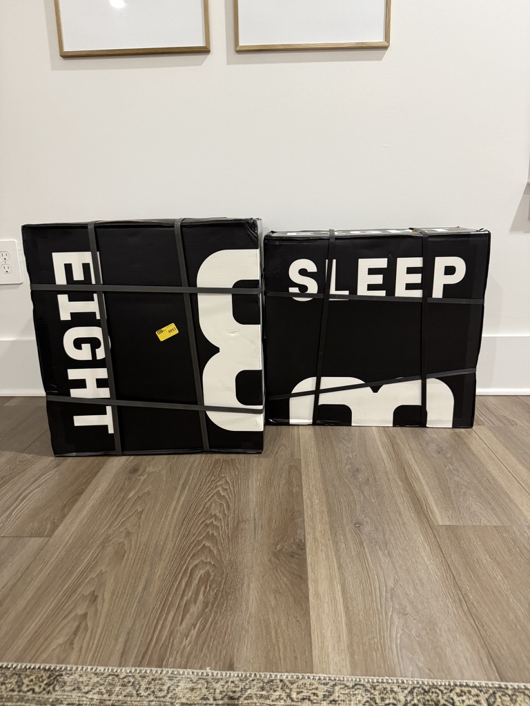 Two boxes wrapped in black with white text