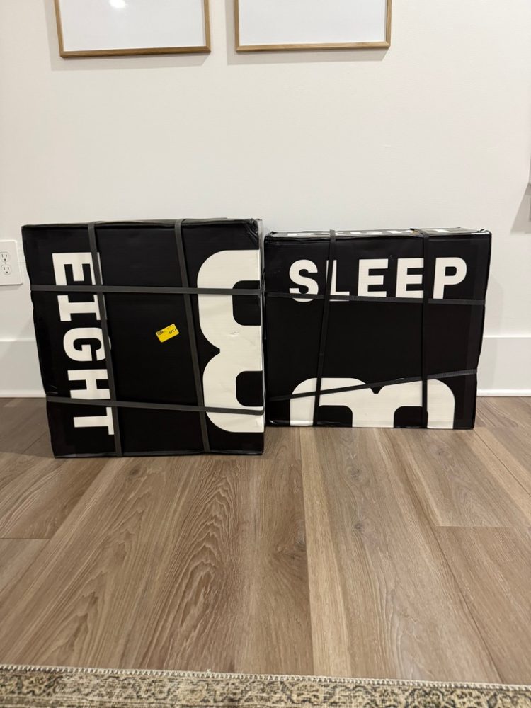Two boxes wrapped in black with white text