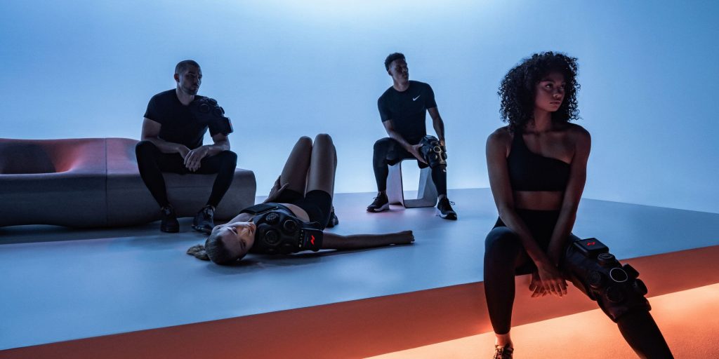 A group of people sitting using contrast therapy